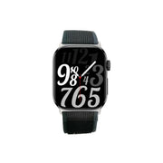 A black Porodo Magnifico 3 smartwatch with a digital display showing time and date, featuring a textured band and a buckle clasp.
