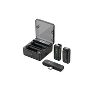 The image shows a Green Lion 2-in-1 microphone with digital display. The microphone is open, revealing its internal components, and there are two wireless transmitter units displayed beside it.